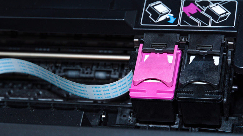Close-up of cartridges in a printer.