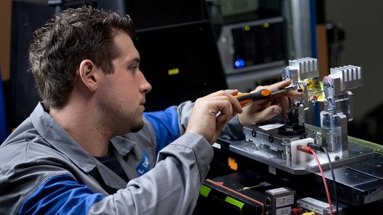 Person working on headlight