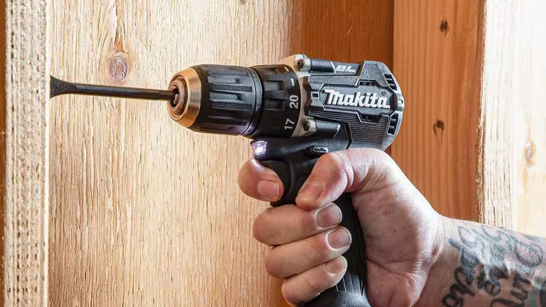 Worker holding the Makita subcompact 1/2 inch drill/driver