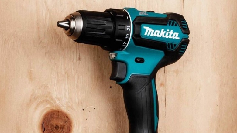 Close up of Makita XFD131 18V LXT ½-inch Brushless Drill/Driver in front of plywood