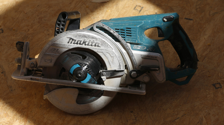 Makita circular saw on wooden surface