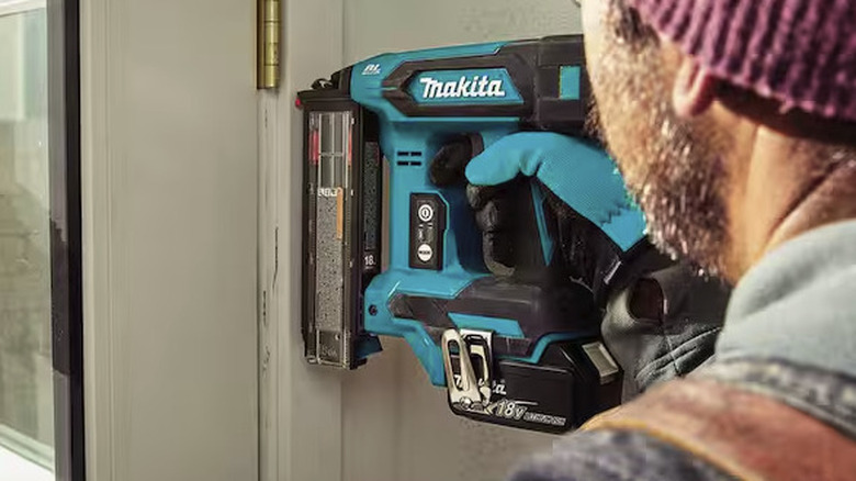 Makita brad nailer in use