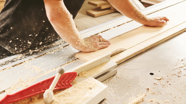 person working with wood