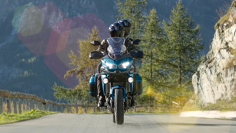 Kawasaki Versys 650 on a mountain road with two riders