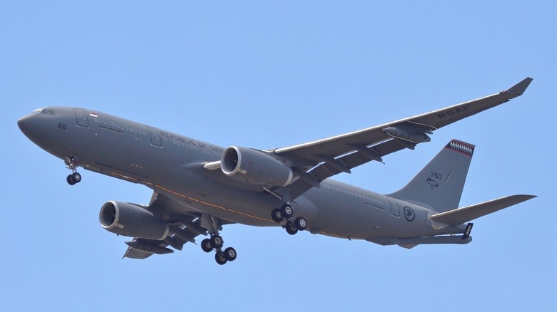 Airbus A330 MRTT multi-role refueling tanker of Republic of Singapore Air Force seen from below left with its landing gear partly retracted