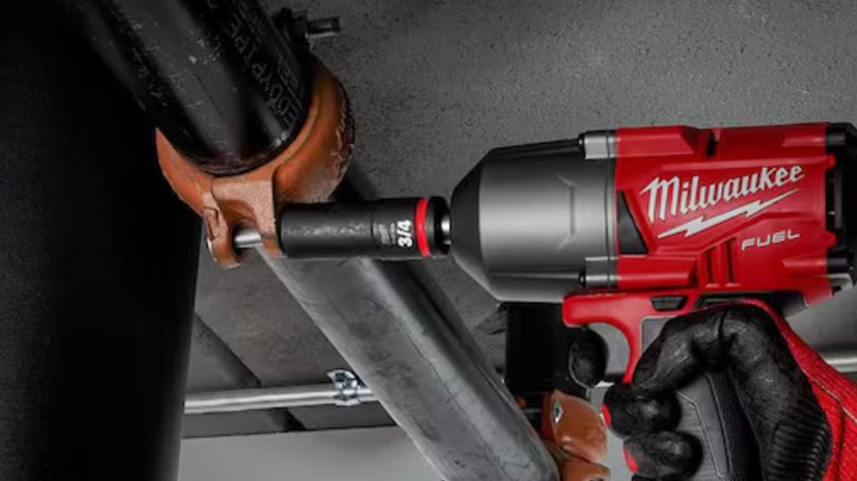 Milwaukee driver with Shockwave Impact Duty ⅜-inch Drive 6-Point Socket in use