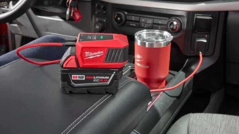 Stock photo of a Milwaukee Tool power supply inside a car