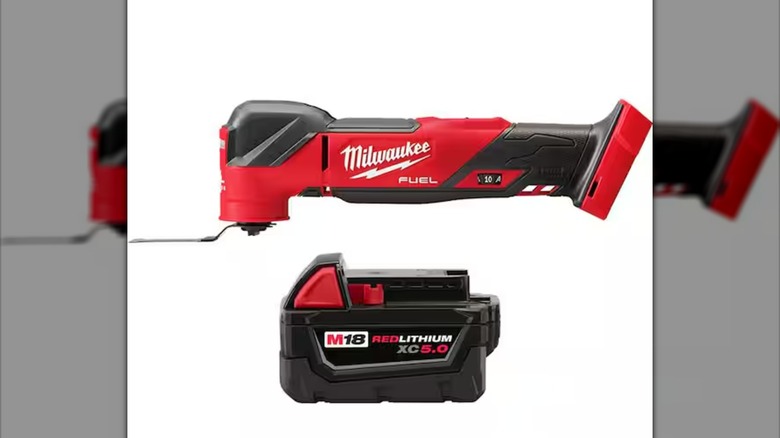 A Milwaukee oscillating multi-tool and battery pack against a white background.
