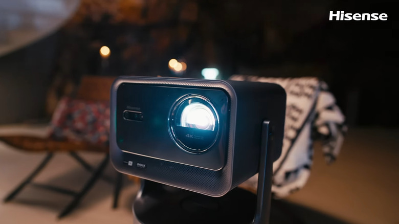 Hisense C2 Pro 4K Portable Laser Mini Projector turned on and used outdoors