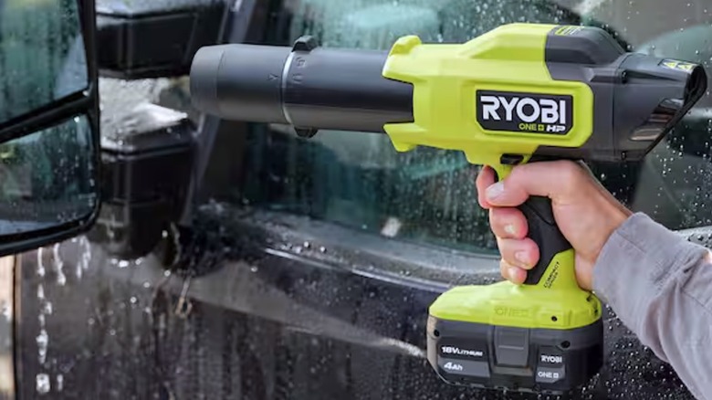 Person using Ryobi mini blower