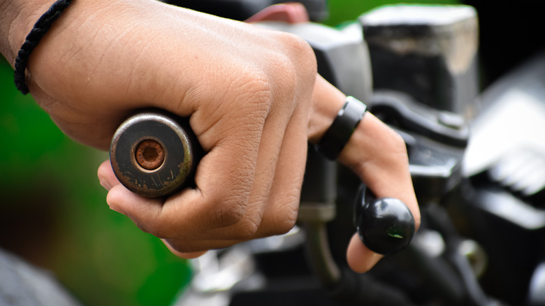 hand on a motorcycle handle