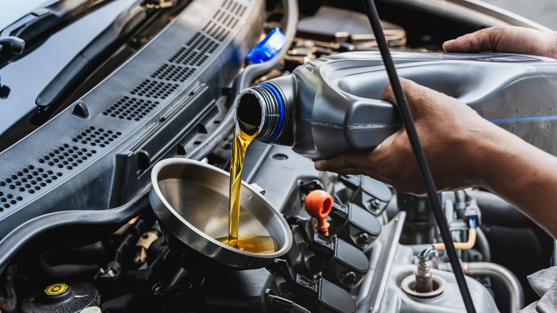 Pouring oil into the engine