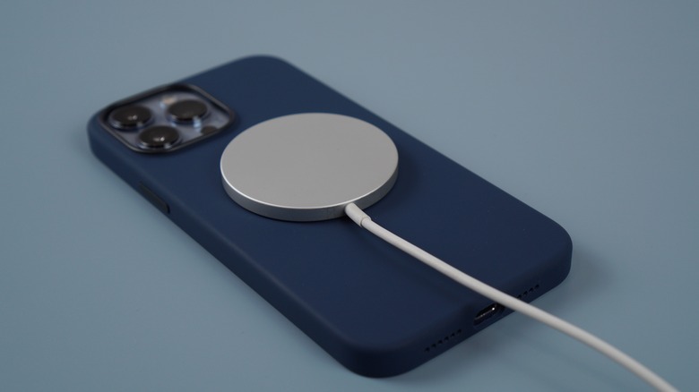 iPhone with magsafe charger attached
