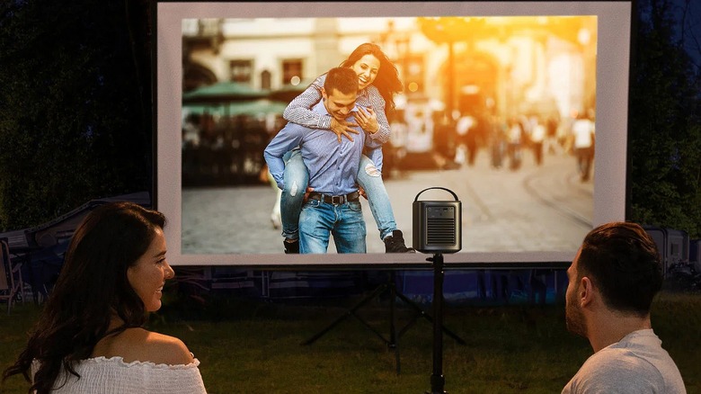 People using portable projector