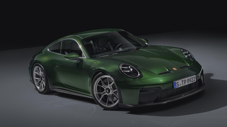 Porsche 911 GT3 in green against gray and black background