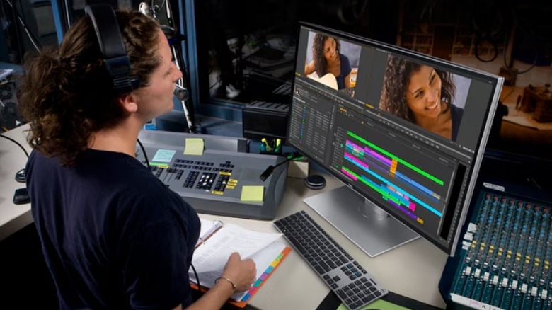 Woman using Dell UltraSharp UP3218K monitor