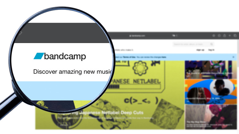 Bandcamp home page with magnifying glass over logo