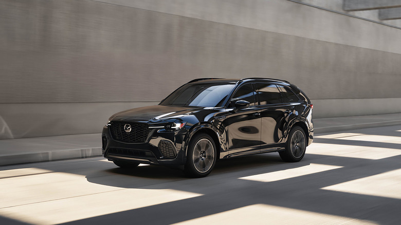 A black 2025 Mazda CX-70 driving