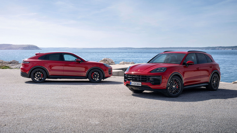 Red 2024 Porsche Cayenne GTS Coupe and Cayenne GTS regular SUV body parked at an seaside overlook