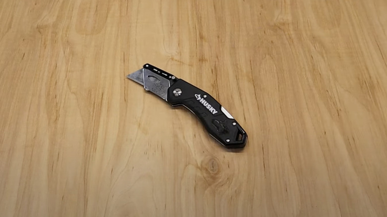 Folding knife on a wooden table