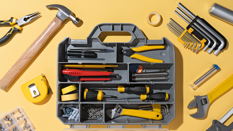 Open toolbox overstuffed with tools