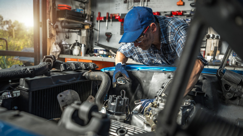 Classic car owner works on a project car