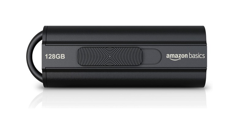 A 128 GB Amazon Basics USB drive on a white background