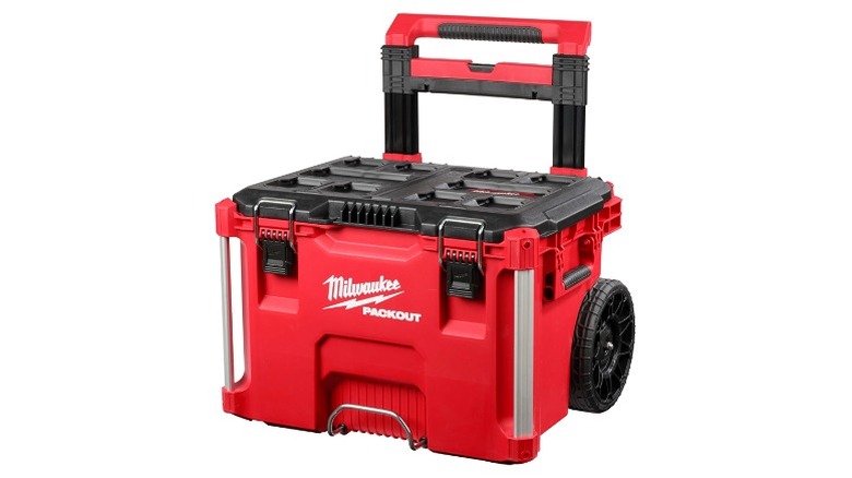 Red and black rolling Milwaukee Packout toolbox with extension handle