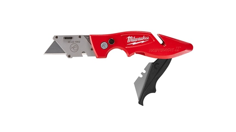 A utility knife by Milwaukee with two separate blades exposed