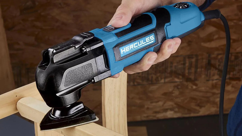 The Hercules multi-tool being used to sand furniture