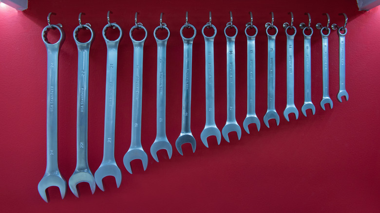 box-end wrenches hanging on hooks