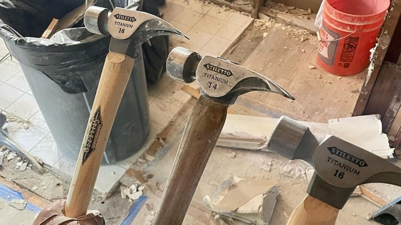 builders holding Stiletto hammers at jobsite