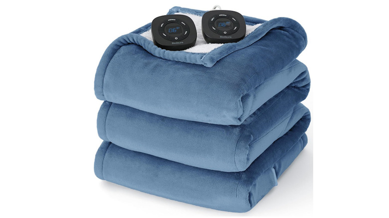 Stacks of blue Bedsure Heated Blankets with the heating gauges sitting on top with a white background