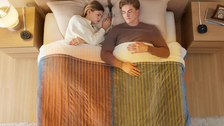 Couple sleeping in a bedroom covered by the Bedsure Electric Blanket