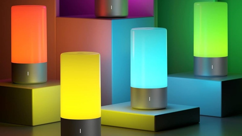 Multiple Rootro Table Lamps with different colored lights on