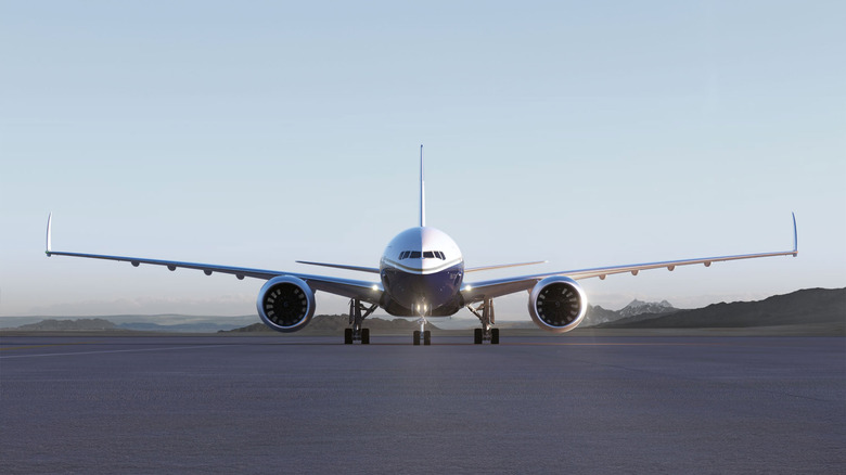 Boeing BBJ777X on a runway with clear blue skies