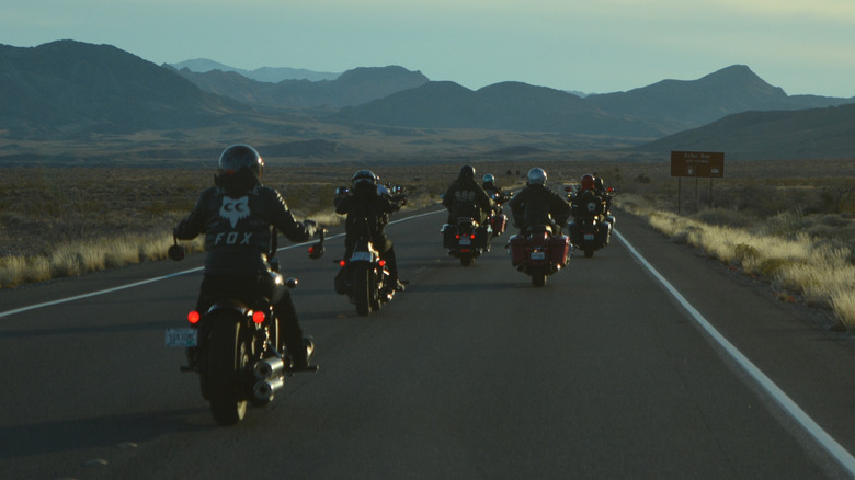 Motorcycle riders in a staggered formation