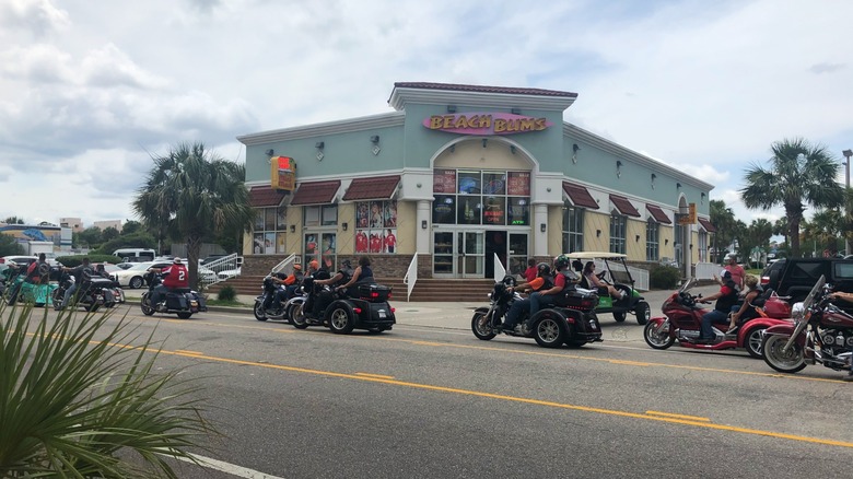 Motorcycles riding down Myrtle Beach street during Bike Week
