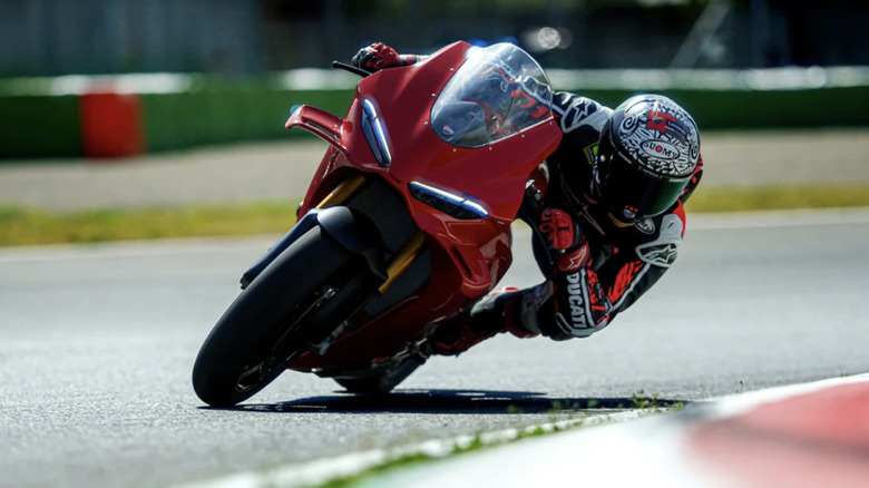 Ducati V4 leaning over at a racetrack