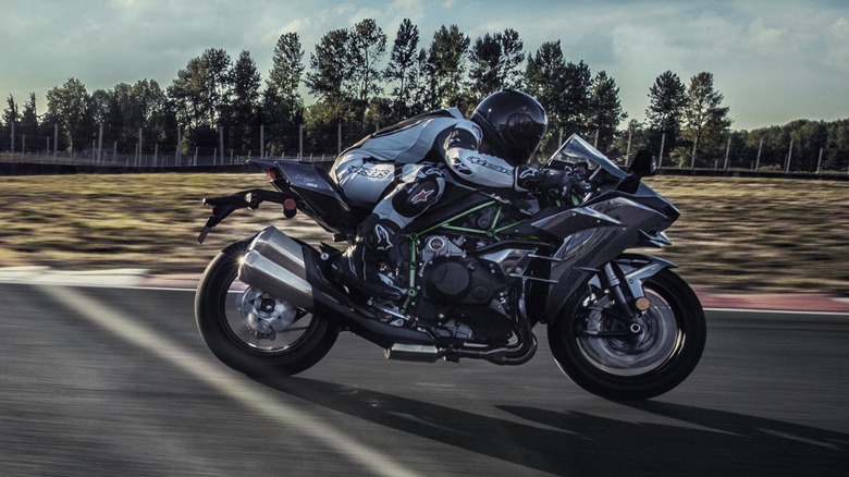 Kawasaki H2 with a rider on the racetrack