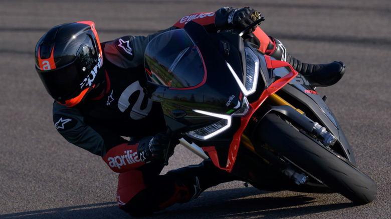Aprilia RSV4 Factory fully leaned over at a racetrack