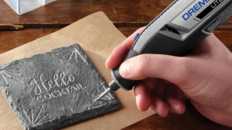 person using Dremel Lite