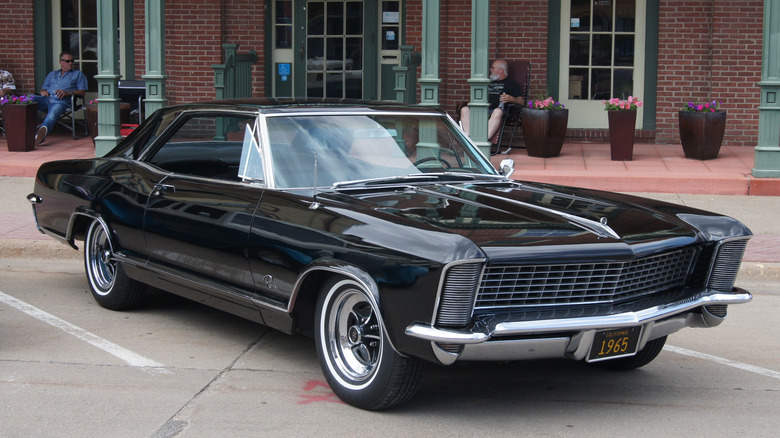 1965 Buick Riviera parked on roadside, front-right 3/4 view