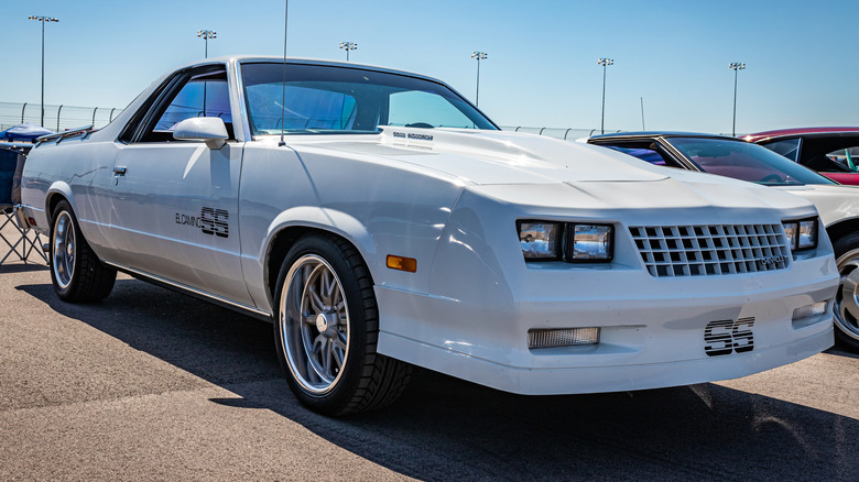 Front 3/4 view of 1980s Chevy El Camino SS parked at car show.