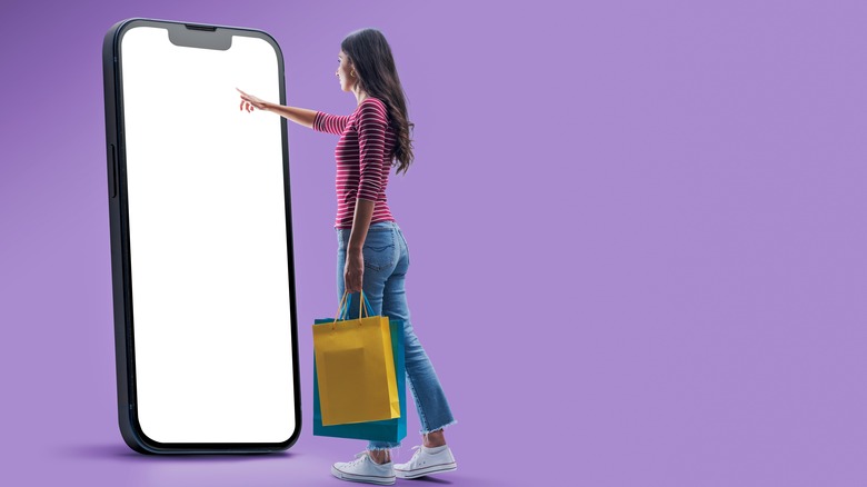 Woman shopping with giant phone