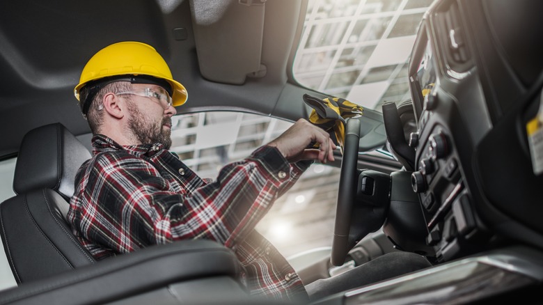 A Construction Worker Sitting Inside Truck