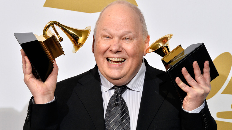 Bob Ludwig holding two of his Grammys