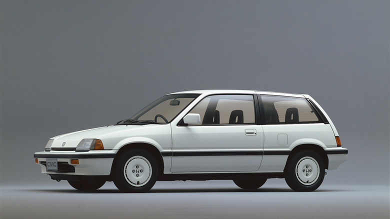 1987 Honda Civic 3-door hatchback on gray background, left-side view