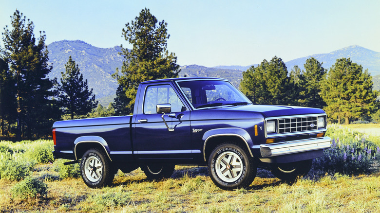 1985 Ford Ranger XL parked in forest terrain, front-right 3/4 view