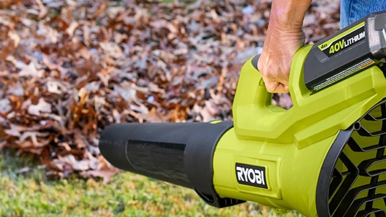 A person using the Ryobi 40V 475 CFM Blower.